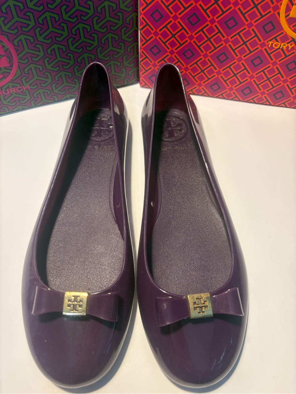 Tory Burch Patent Ballet Flats in Deep Plum with Gold Logo Bow